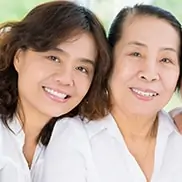 Mother and daughter smiling