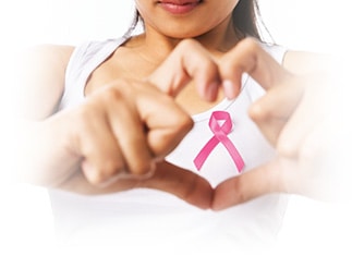 A lady is framing the breast cancer awareness symbol