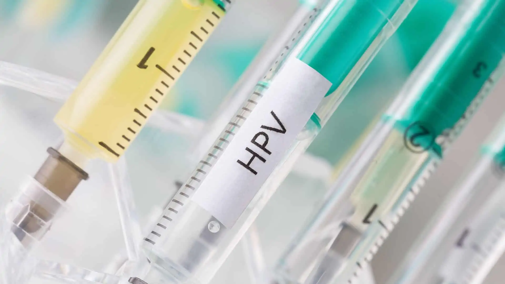 Syringe with HPV vaccine for both men and women