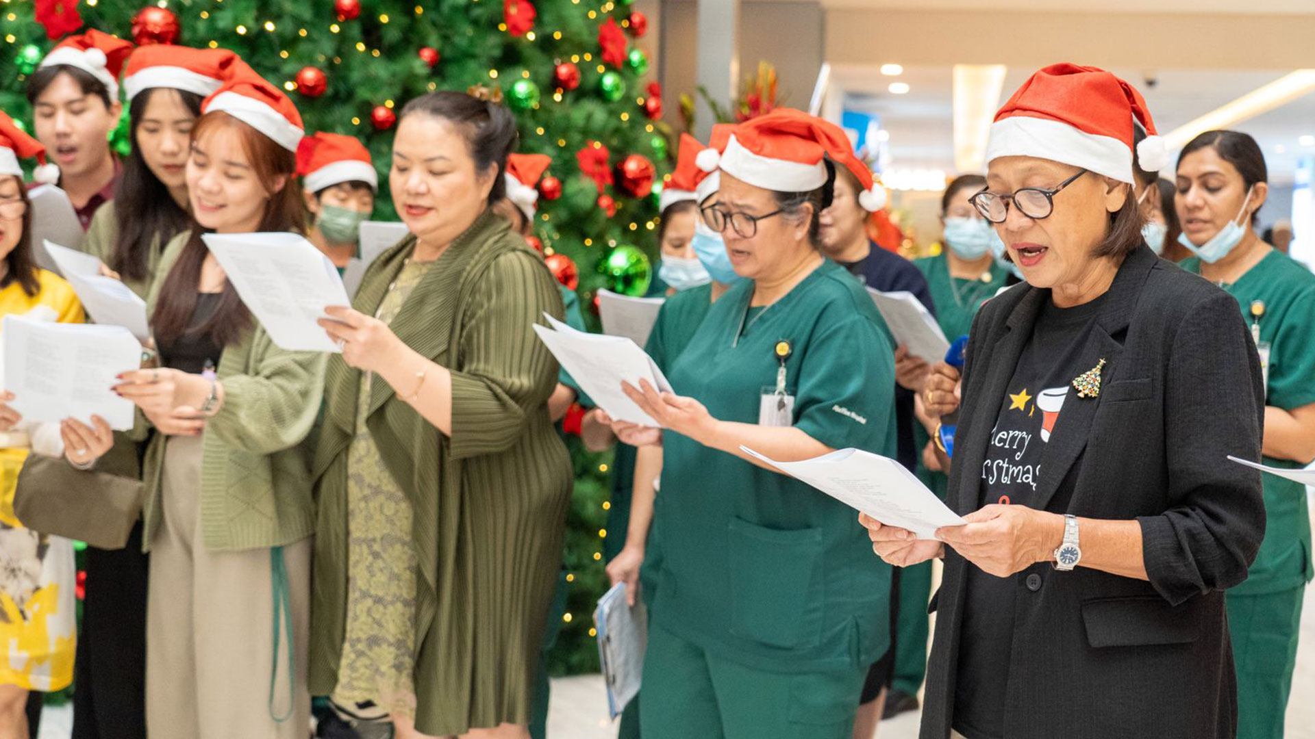 Christmas Caroling singing at raffles hospital lobby 2025