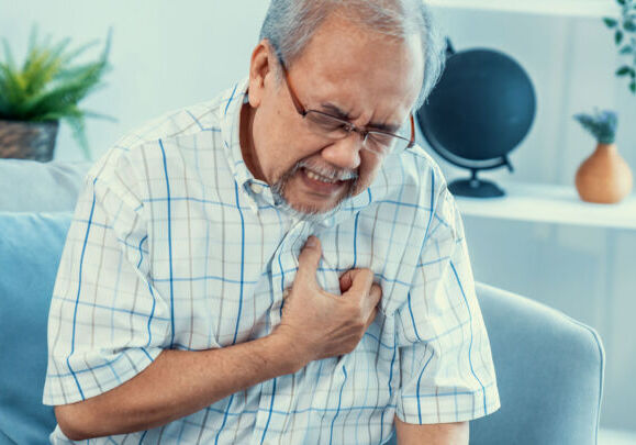 Elderly man experiencing heart attack
